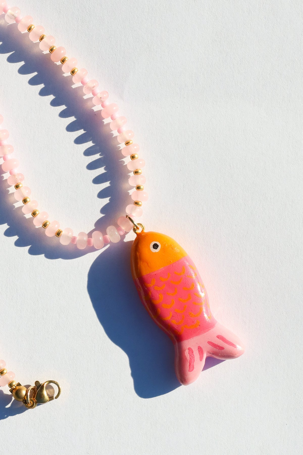 orange and pink fish charm necklace
